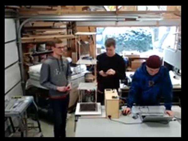 Students presenting their project by video call from a garage workshop